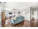 Spacious living room featuring a cozy fireplace, hardwood flooring, and plenty of natural light at 5619 Payne Blvd, Plainfield, IN 46168