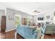 Comfortable living room with hardwood floors, a ceiling fan, and natural light from multiple windows at 5619 Payne Blvd, Plainfield, IN 46168