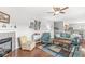 Inviting living room showcasing a fireplace, wood floors, and an open layout for entertaining at 5619 Payne Blvd, Plainfield, IN 46168