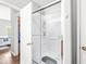 Modern shower with glass doors, offering a clean and stylish space for relaxation and rejuvenation at 5619 Payne Blvd, Plainfield, IN 46168