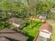 Aerial view of a private backyard with detached garages, and a lush lawn at 5622 Guilford Ave, Indianapolis, IN 46220