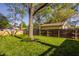 Grassy backyard featuring a mature tree and new wooden fence at 5622 Guilford Ave, Indianapolis, IN 46220