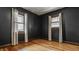 Modern bedroom features hardwood floors and natural light at 5622 Guilford Ave, Indianapolis, IN 46220
