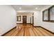 This wide hallway features hardwood floors and natural light at 5622 Guilford Ave, Indianapolis, IN 46220