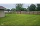 Large, well-manicured backyard with a tall wooden fence providing privacy to the property at 5805 S Gale St, Indianapolis, IN 46227
