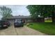 Charming single-story brick home with a well-maintained front yard and a two-car attached garage at 5805 S Gale St, Indianapolis, IN 46227