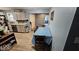 Bright eat-in kitchen featuring white cabinets, stainless steel appliances and wood look floors at 5805 S Gale St, Indianapolis, IN 46227