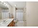 Clean bathroom with a single sink vanity, shower, and neutral decor at 6034 Doverton Dr, Noblesville, IN 46062
