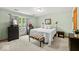 Comfortable bedroom featuring neutral walls, a window, and soft lighting at 6034 Doverton Dr, Noblesville, IN 46062