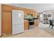 Bright kitchen with stainless steel appliances and ample storage space with a view into the dining area at 6034 Doverton Dr, Noblesville, IN 46062