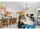 Spacious kitchen featuring modern appliances, barstool seating, and a connected dining area at 6034 Doverton Dr, Noblesville, IN 46062