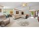 Open-concept living room leading to the kitchen and dining area with abundant natural light at 6034 Doverton Dr, Noblesville, IN 46062