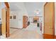 Inviting living room with a cozy brick fireplace, neutral carpet and a ceiling fan at 6034 Doverton Dr, Noblesville, IN 46062