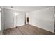 View of an empty bedroom with light colored walls and vinyl plank flooring at 611 Hampton Ln, Anderson, IN 46017