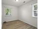 This bedroom is bright with natural light and new flooring at 611 Hampton Ln, Anderson, IN 46017