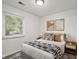 Beautifully decorated bedroom with neutral paint and decorative pillows provides a comforting space at 611 Hampton Ln, Anderson, IN 46017