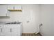 Bright kitchen sink with white cabinetry provides a functional and clean space at 611 Hampton Ln, Anderson, IN 46017