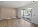 Bright living room featuring vinyl plank floors and a large window at 611 Hampton Ln, Anderson, IN 46017