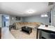 Finished basement features a cozy sectional sofa, a colorful rug, and a small dining table at 752 N Leland Ave, Indianapolis, IN 46219