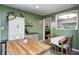 Open kitchen featuring butcher block island, and view to breakfast table and fireplace at 752 N Leland Ave, Indianapolis, IN 46219