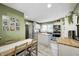 Well-lit kitchen with stainless steel appliances, white cabinets, and a butcher block island at 752 N Leland Ave, Indianapolis, IN 46219