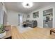 Open living space with hardwood floors and access to the kitchen and hallway at 752 N Leland Ave, Indianapolis, IN 46219
