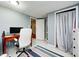 Bright office space features a comfortable chair, desk, monitor, and modern finishes for an ideal work environment at 752 N Leland Ave, Indianapolis, IN 46219