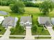 An aerial view of a well maintained home with a long driveway and beautiful lawn at 7559 Pipestone Dr, Indianapolis, IN 46217