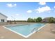 Inviting community pool with lounge chairs, lifeguard stand, and nearby trees, perfect for summer relaxation and recreation at 7559 Pipestone Dr, Indianapolis, IN 46217
