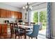 Charming dining area with sliding glass doors to the backyard and elegant chandelier at 7559 Pipestone Dr, Indianapolis, IN 46217