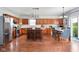 Updated kitchen with stainless steel appliances, kitchen island, and cozy dining area at 7559 Pipestone Dr, Indianapolis, IN 46217