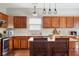 Well-appointed kitchen with granite counters, island seating, and stainless steel appliances at 7559 Pipestone Dr, Indianapolis, IN 46217