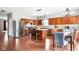 Well-lit kitchen featuring stainless steel appliances and a wooden island with bar seating at 7559 Pipestone Dr, Indianapolis, IN 46217
