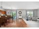 Bright, open living area with hardwood floors, comfortable seating, and access to the patio at 7559 Pipestone Dr, Indianapolis, IN 46217