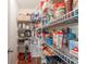 Well-stocked pantry with white wire shelving providing ample storage space for food and kitchen essentials at 7559 Pipestone Dr, Indianapolis, IN 46217