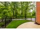 Well-maintained backyard with lush green grass and a sleek black fence at 7601 W Stonegate Dr, Zionsville, IN 46077