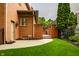 Beautiful backyard featuring manicured grass, tasteful landscaping, and a charming brick exterior at 7601 W Stonegate Dr, Zionsville, IN 46077