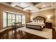 Charming bedroom features a tray ceiling, large windows, and a cozy sitting area at 7601 W Stonegate Dr, Zionsville, IN 46077