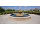 A charming outdoor water fountain surrounded by well-maintained landscaping, benches, and a community park at 7601 W Stonegate Dr, Zionsville, IN 46077