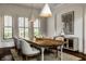 Dining area featuring a wooden table with seating for six and ample natural light at 7601 W Stonegate Dr, Zionsville, IN 46077