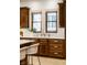 Gourmet kitchen featuring wood cabinets, undermount sink and white marble countertop at 7601 W Stonegate Dr, Zionsville, IN 46077