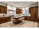 Spacious kitchen with center island, breakfast bar and stainless steel appliances at 7601 W Stonegate Dr, Zionsville, IN 46077