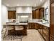 Kitchen with a center island, granite countertops, custom cabinets and stainless appliances at 7601 W Stonegate Dr, Zionsville, IN 46077