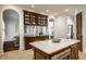 Kitchen island featuring granite countertop, pendant lights and plenty of storage at 7601 W Stonegate Dr, Zionsville, IN 46077