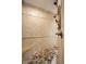 Tile shower with dual showerheads and a built-in bench for a luxurious experience at 7601 W Stonegate Dr, Zionsville, IN 46077