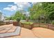 Spacious backyard with a wooden deck, play set, and string lights, perfect for outdoor activities at 764 Bloor Woods Ct, Zionsville, IN 46077