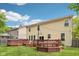 Open backyard featuring well-maintained lawn space with multiple decks and beautiful string lighting at 764 Bloor Woods Ct, Zionsville, IN 46077