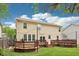 Large, level backyard with a spacious deck and string lights for evening enjoyment at 764 Bloor Woods Ct, Zionsville, IN 46077