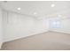 Basement boasts carpet flooring and recessed lighting for a bright and airy feel at 764 Bloor Woods Ct, Zionsville, IN 46077
