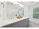 Bathroom with double vanity, granite countertops, and modern fixtures at 764 Bloor Woods Ct, Zionsville, IN 46077